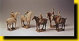 Painted pottery figures of polo players (replica)