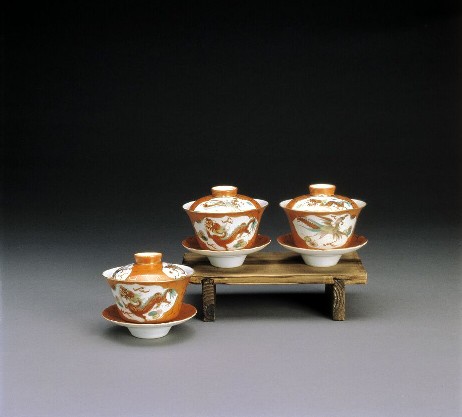 Dragons and Phoenixes Covered Bowls and Saucers with Panels Painted in Overglaze Enamels on Red Ground