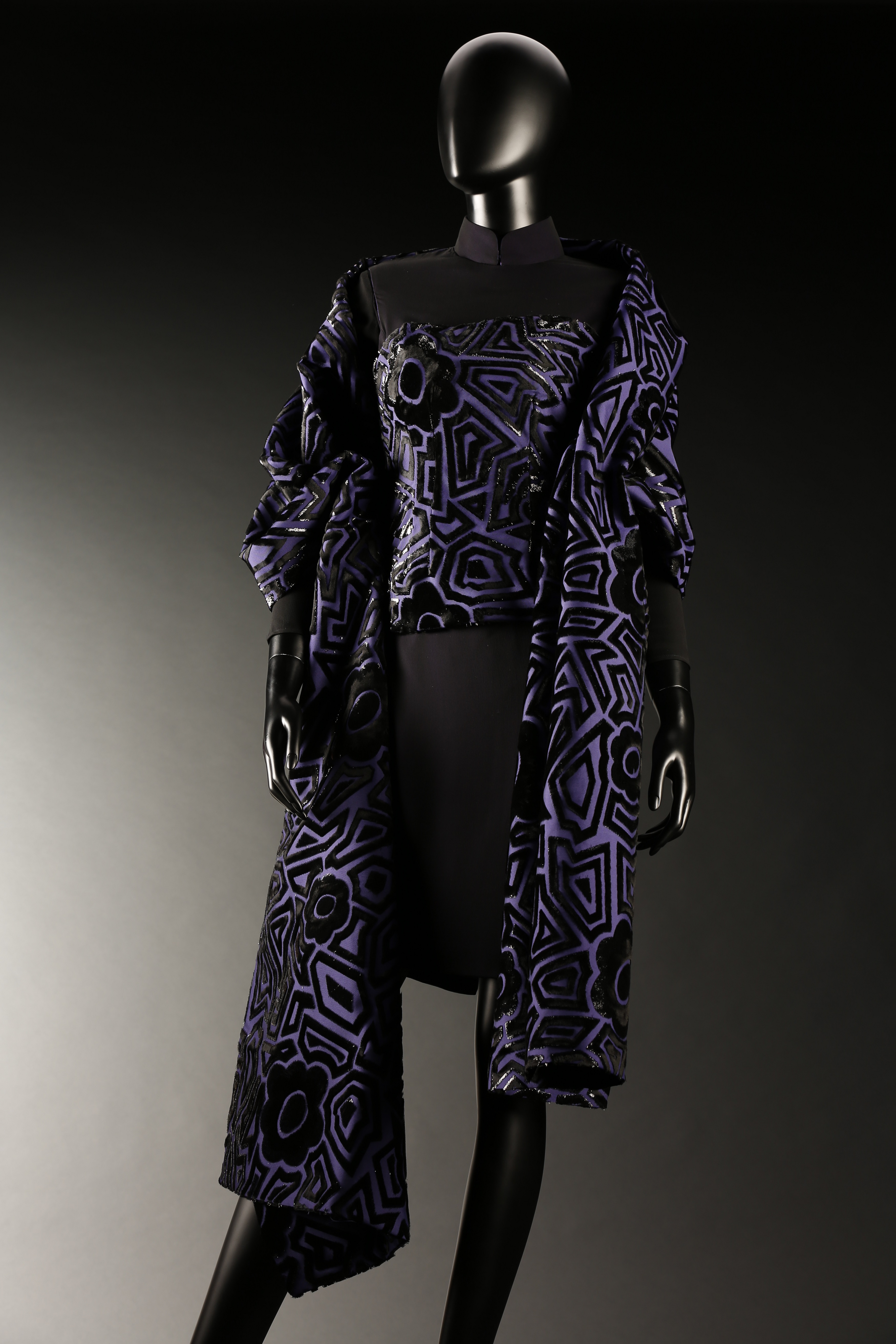 Pak Suet Sin cheongsam in purple with black floral pattern with matching shawl