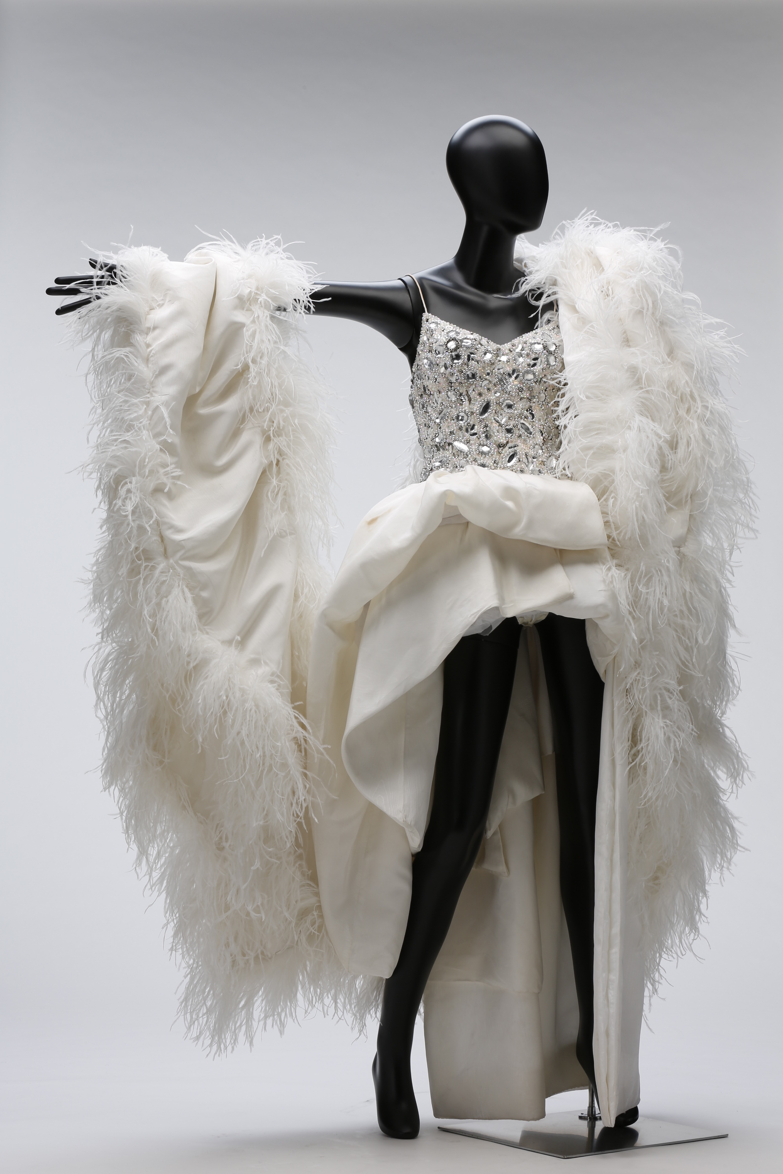 Anita Mui gem-set camisole dance outfit with white lower hem and feather shawl