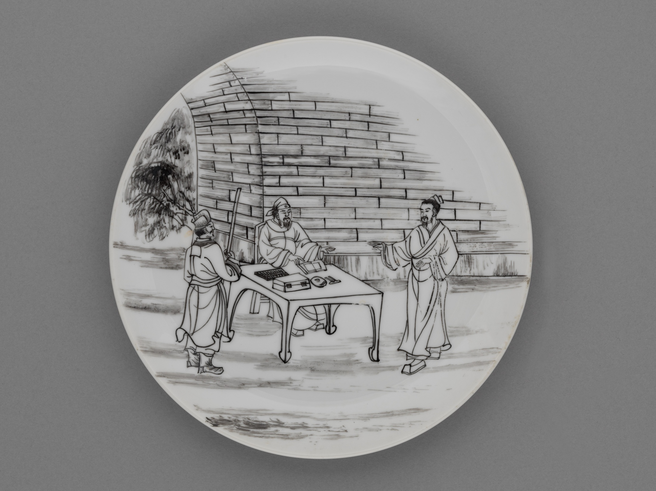 Plate with scene of Jesus calling the tax collector painted in black