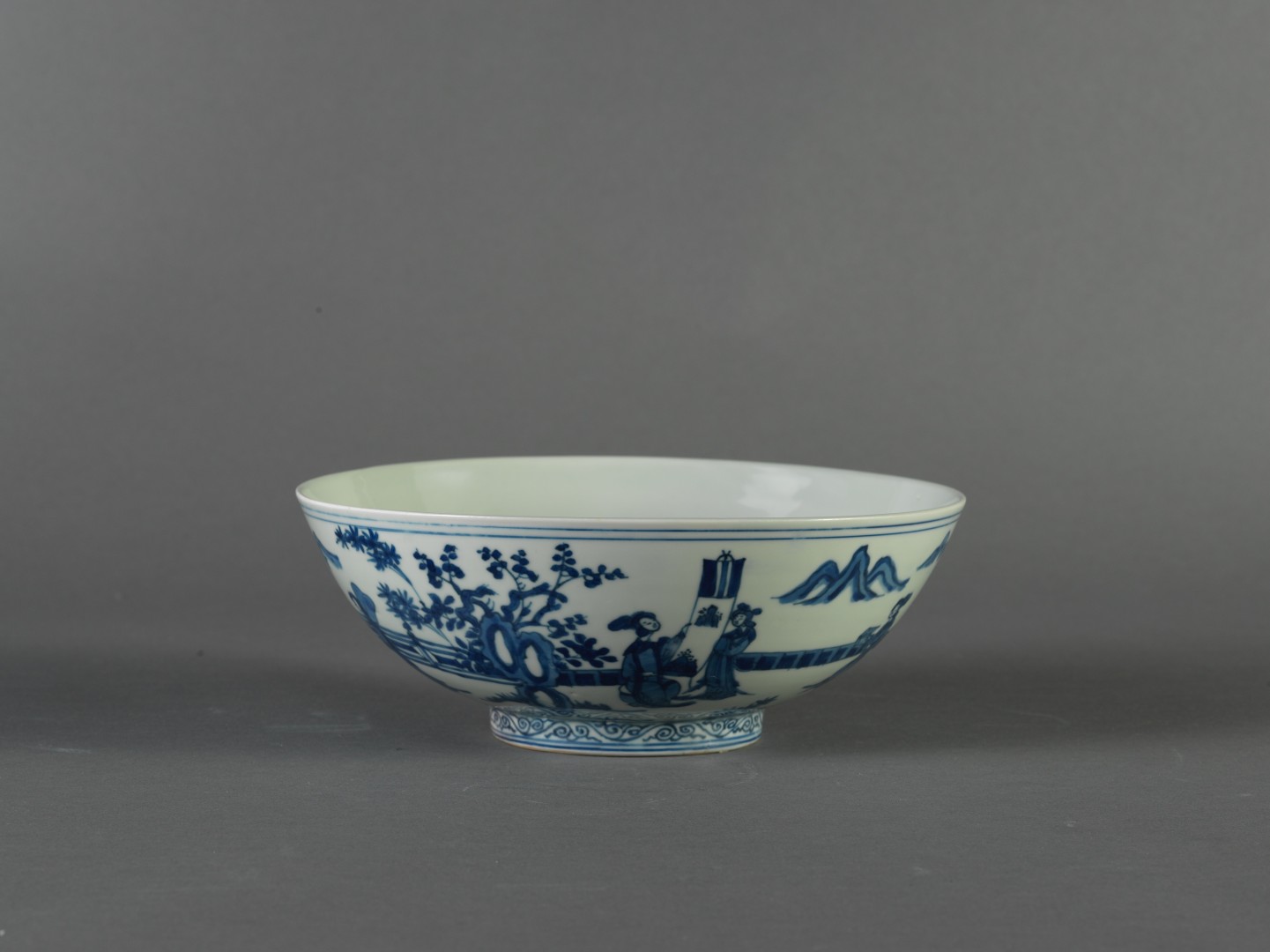 Bowl in underglaze blue decoration of ladies in garden scene
