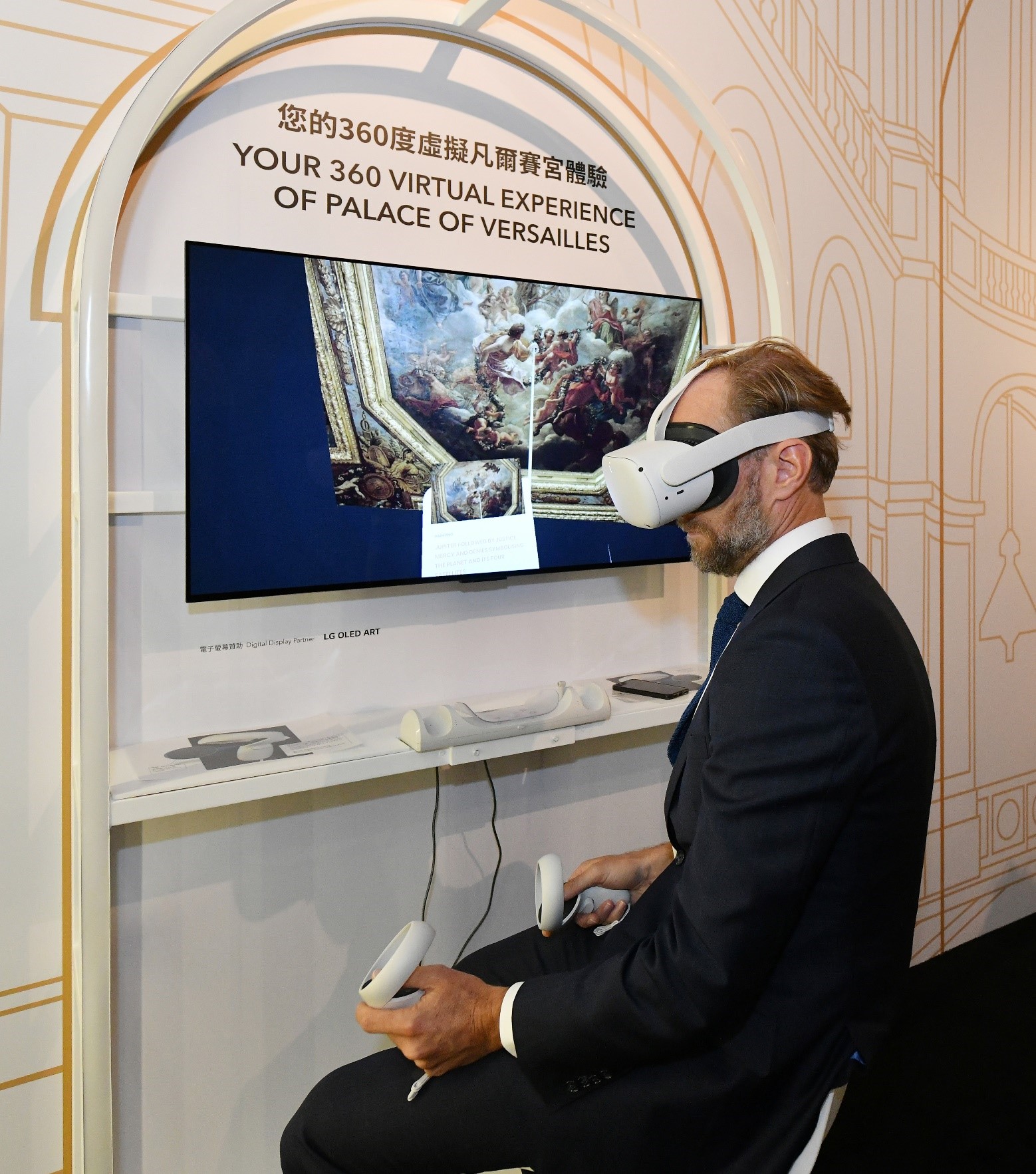 Mr Xavier Mahé, General Manager of French May Arts Festival, put on a VR headset to experience a 360 degree virtual tour of the Palace of Versailles.